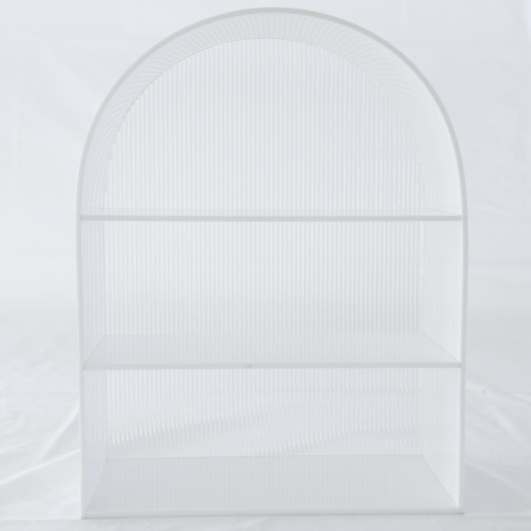 White arch-shaped frame on a light gray background